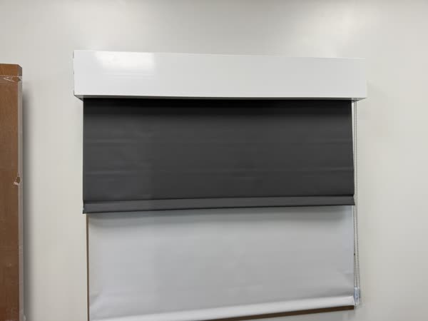 Dual roller shades - a sheer and a blackout shade on one bracket