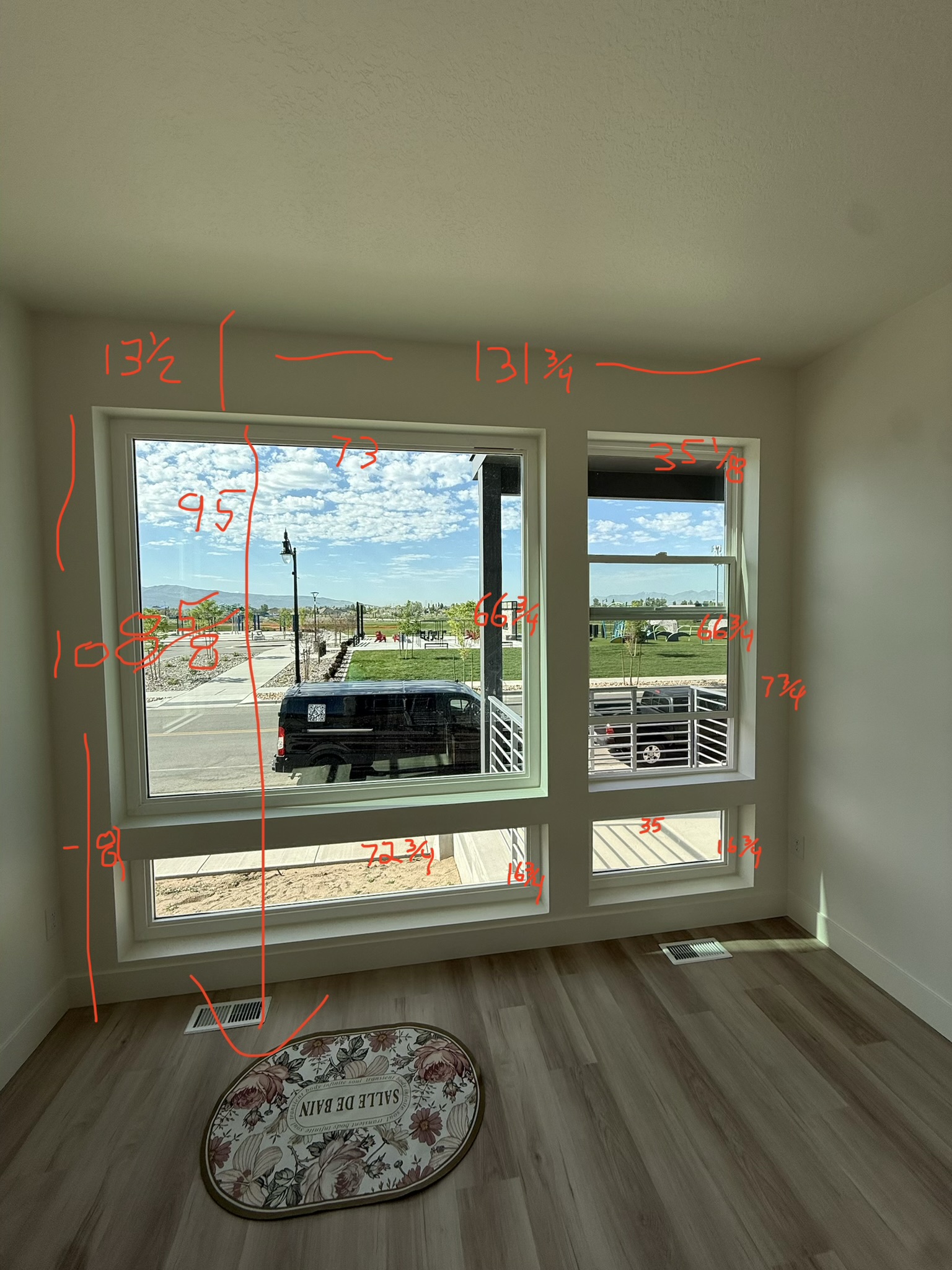 Annotated window measurement photo from a real Blindznation job site — inside widths, outside span, heights, and trim depths all recorded in red